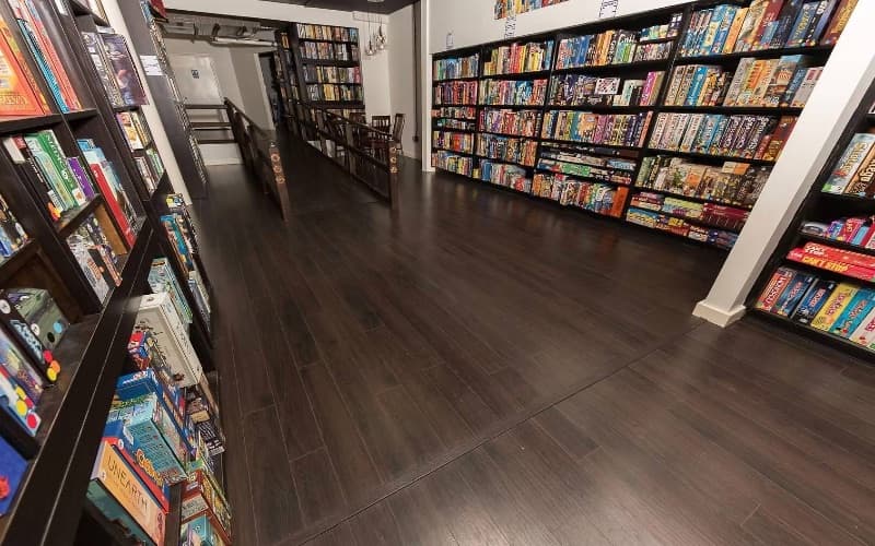 Shelves of board games lining both walls of the library room